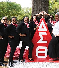 Members of the Delta Sigma Theta Sorority Beta Epsilon Chapter celebrating their 35th reunion gather at the sorority’s plot on the Lombardy Street campus for a group photo.