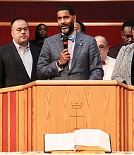 The Rev. Otis Moss III, center, is surrounded by other Chicago church leaders and denomination officials with the United Church of Christ to announce on Oct. 20 that the group paid off $5.3 million in medical debt for poor people in Illinois.