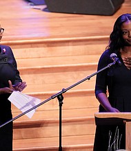 Jennifer Cummings, left, applauds in response to remarks by her sister, Adia Cummings, during the funeral of their father, Rep. Cummings.