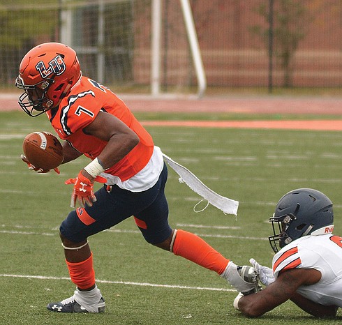 Lincoln University’s Deontae Brockington makes some headway before being taken down by the Virginia State University defense in last Saturday’s game at the school in Pennsylvania. VSU defeated Lincoln 33-5.