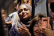 Supporters celebrate the victory speeches given by Democratic candidates at the political party’s gathering Tuesday night at a Downtown hotel.