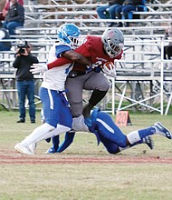 Virginia Union University running back Tabyus Taylor, right, skirts the Elizabeth City State University defense during last Saturday’s game at Hovey Field. Taylor led the Panthers’ running game with 98 yards and a touchdown.