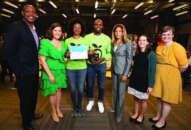 Bronzeville residents Augustine and Sylvia Emuwa (middle), co-founders of Dinobi Detergent, recently received $5,000 and a one-year membership to Polsky Exchange as their prize for winning first place in the annual South Side Pitch Competition. Photo Credit: Provided by Dinobi Detergent.