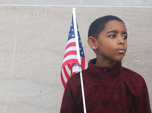 Tristan Williams, 8, takes in the sights and sounds Monday at the 63rd Annual Commonwealth Veterans Day Ceremony at the Virginia War Memorial in Downtown. The third-grader was attending the event with his Virginia Virtual Academy class members and their teacher, Deborah De Los Santos.
