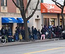 Harlem residents line up at a community food pantry