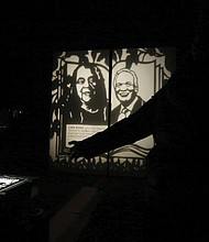 The installation “A Garden of Illuminated History” by Detroit-based artist Carrie Morris, a Midlothian native, illuminates figures of late activist Lillie Estes and Raymond H. Boone Sr., the late founder and publisher of the Richmond Free Press.