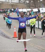 The first place winner in the women’s division also is from Ethiopia. She is Ayantu Dakebo Hailemariyan, 23, crossing the finish line, left, at 2:36:19.