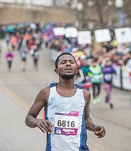 Ashenafi Birhana, a native of Ethiopia who now lives in Washington, crosses the finish line last Saturday to win the 42nd Annual Richmond Marathon with a time of 2:19:23.