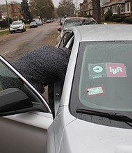 Ride-share passengers downtown are poised to pay higher fares to use Uber and Lyft under a proposal by Mayor Lori Lightfoot. Photo credit: By Wendell Hutson