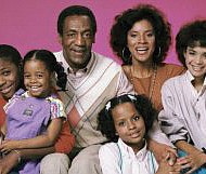 This photo shows Bill Cosby portraying Dr. Cliff Huxtable with his television family in the long-running and hugely popular hit “The Cosby Show.” The show was created by Mr. Cosby.