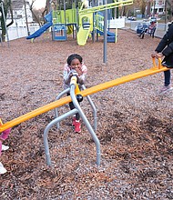 Life can be a balancing act, even when you’re young and on a see-saw. On Sunday, Ava El, 6, left, plays on a see-saw with friend Tye’asjah Morris, 6, right, at the Third Avenue Tot Lot in Highland Park as her sister, Kailee El, 8, waits her turn. The youngsters were at the lot at Third Avenue and Althea Street under the watchful eye of mother Ashley El, who can be seen on the bench in the background.