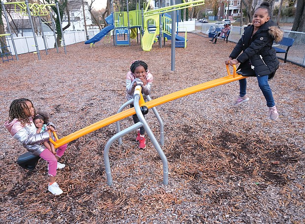 Life can be a balancing act, even when you’re young and on a see-saw. On Sunday, Ava El, 6, left, plays on a see-saw with friend Tye’asjah Morris, 6, right, at the Third Avenue Tot Lot in Highland Park as her sister, Kailee El, 8, waits her turn. The youngsters were at the lot at Third Avenue and Althea Street under the watchful eye of mother Ashley El, who can be seen on the bench in the background.
