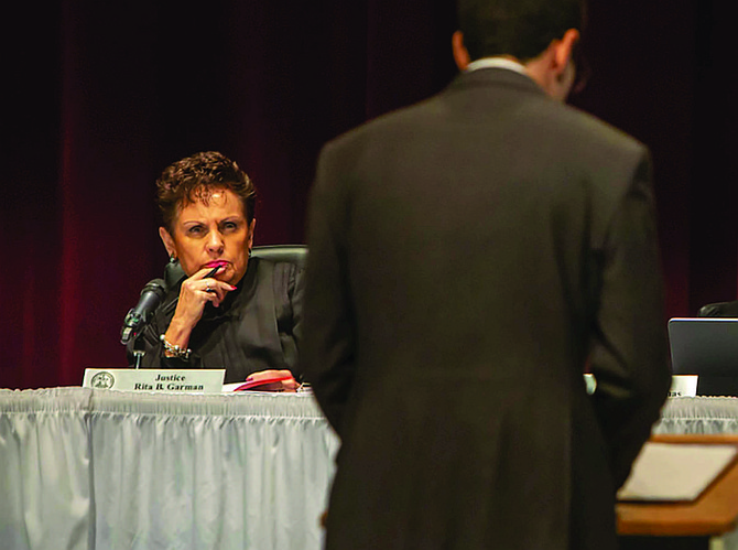 Illinois Supreme Court Justice Rita Garman listens to oral arguments being made by Assistant Appellate Defender Zachary Rosen in the People v. Morger case Sept. 18 at Lewis and Clark Community College in Godfrey during a public event held to “raise the profile of the judicial branch.” Credit: Illinois Supreme Court.