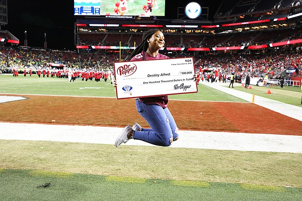 “Destiny Alfred secured $100,000 in free tuition after competing in the Dr Pepper Tuition Giveaway during the halftime of the PAC 12 Conference Championship (Photo Credit: Dr Pepper)”