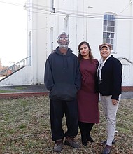 Jerome Legions, president of the Carver Area Civic Improvement League, stands with 2nd District City Councilwoman Kim B. Gray, center, and past civic league president Charleen Baylor outside the vacant Moore Street School in the Carver neighborhood.