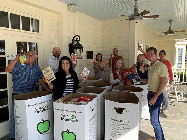 Team members from David Weekley Homes donated 14,000 pounds of Thanksgiving food items to Houston Food Bank to benefit families in need.