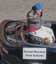 The holiday fun continued last Saturday with the 36th Annual Christmas Parade. People of all ages lined the 2-mile route along Broad Street to enjoy the bevy of featured floats, bands and giant balloon characters. In this photo, Parade Grand Marshal Paul Galanti, who was a P.O.W. during the Vietnam War, waves to the crowd.