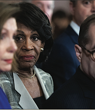 Congresswoman Maxine Waters, center, chair of the House Financial Services Committee, joins House Speaker Nancy Pelosi and Rep. Jerrold Nadler, chair of the House Judiciary Committee, during a news conference Tuesday announcing the articles of impeachment against President Trump.
