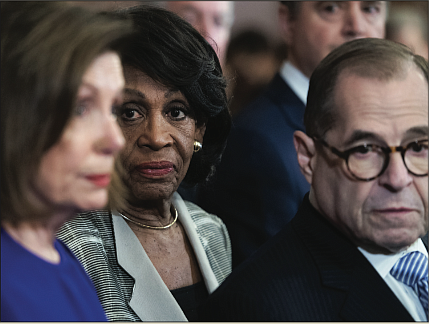 Congresswoman Maxine Waters, center, chair of the House Financial Services Committee, joins House Speaker Nancy Pelosi and Rep. Jerrold Nadler, chair of the House Judiciary Committee, during a news conference Tuesday announcing the articles of impeachment against President Trump.