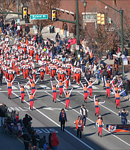 The Virginia State University Trojan Explosion Marching Band puts out a big sound as they march down the route into Downtown.