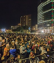 Hundreds of people pack Kanawha Plaza last Friday for “RVA Illuminates,” the new holiday lighting celebration of Downtown. The event, sponsored by the city Department of Parks, Recreation and Community Facili- ties, featured music and holiday characters, including Jack Frost and the Snow Queen.
