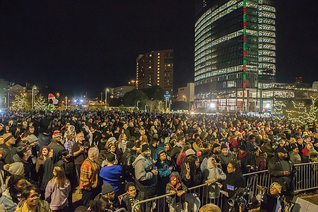 Hundreds of people pack Kanawha Plaza last Friday for “RVA Illuminates,” the new holiday lighting celebration of Downtown. The event, sponsored by the city Department of Parks, Recreation and Community Facili- ties, featured music and holiday characters, including Jack Frost and the Snow Queen.
