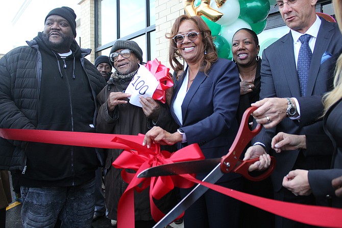 Ald. Leslie Hairston (in blue) participated in a ribbon-cutting ceremony on Dec. 11, 2019 for the grand opening of Local Market, a 62,000-square foot grocery store, now open at the Jeffery Plaza Shopping Center, 2101 E. 71st St. Photo credit: By Wendell Hutson