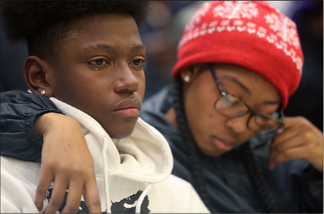 Devin Carter, 15, left, and his cousin, Davionna Green, remember and honor Devin’s brother, Drequan X. Trice, 18, who was killed in August in North Side.