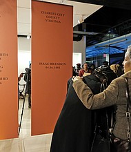 Dozens of people came to the opening Sunday of “Unbound 2019: Truth & Reconciliation: Part III, Emancipation and Enlightenment Up from Slavery” at the Main Street Station Gallery, which includes a tribute to African-Americans in Virginia who were lynched in the decades after the Civil War. Several people attending the exhibit became emotional while reading the names and information about those who were lynched in the state. According to the Equal Justice Initiative, more than 4,000 people were lynched across the South between 1877 and 1950, while nearly 100 lynchings were documented in Virginia during that time. Speakers at the opening included Dr. Cassandra Newby-Alexander, dean of the College of Liberal Arts at Norfolk State University, and Maurice Henderson, whose trip to the National Memorial for Peace and Justice in Montgomery, Ala., inspired the Richmond tribute.