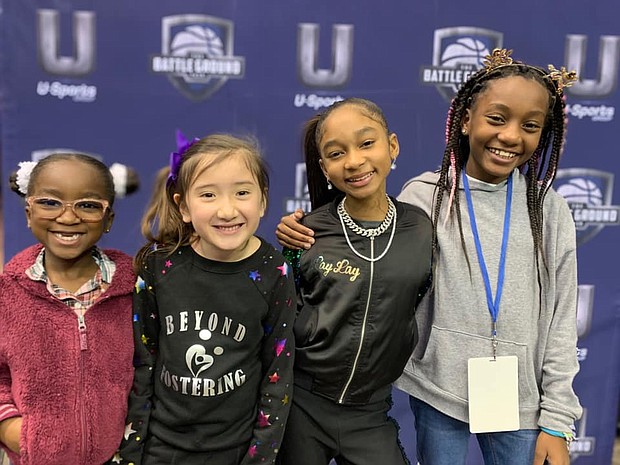 Beyond Fostering, Inc. girls poses with That Girl Lay Lay (3rd from left).