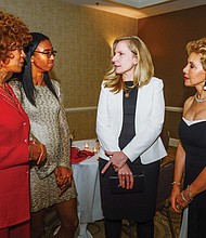 Congresswoman Abigail Spanberger of Henrico, center, talks with, from left, Dr. D. Pulane Lucas, Fredericka Lucas and Beverly Davis at a reception preceding the benefit “Elegance in Black and White” gala hosted by the Richmond Chapter of the Continental Societies last Friday at a Downtown hotel.