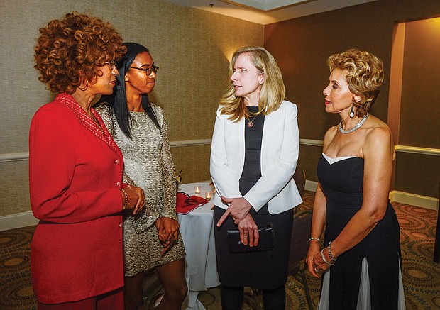 Congresswoman Abigail Spanberger of Henrico, center, talks with, from left, Dr. D. Pulane Lucas, Fredericka Lucas and Beverly Davis at a reception preceding the benefit “Elegance in Black and White” gala hosted by the Richmond Chapter of the Continental Societies last Friday at a Downtown hotel.