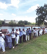 Participants at the Black Lives Global Summit in August march in a line along the Richmond Slave Trail beside the James River in remembrance of the thousands of enslaved people led in coffles from the Old Manchester docks to markets in Shockoe Bottom before the end of the Civil War. Richmond was one of the largest markets in the South for the sale of enslaved people. The summit focused on emotional and psychological healing from the lingering impact of slavery.