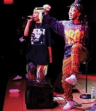 Niambi Sala, left, and Thandiwe of the hip-hop/soul duo OSHUN inspire the crowd with song. The annual celebra- tion of African-American culture ran Dec. 26 through Jan. 1, honoring seven principles — unity, self-determination, collective work and responsibility, cooperative economics, purpose, creativity and faith.