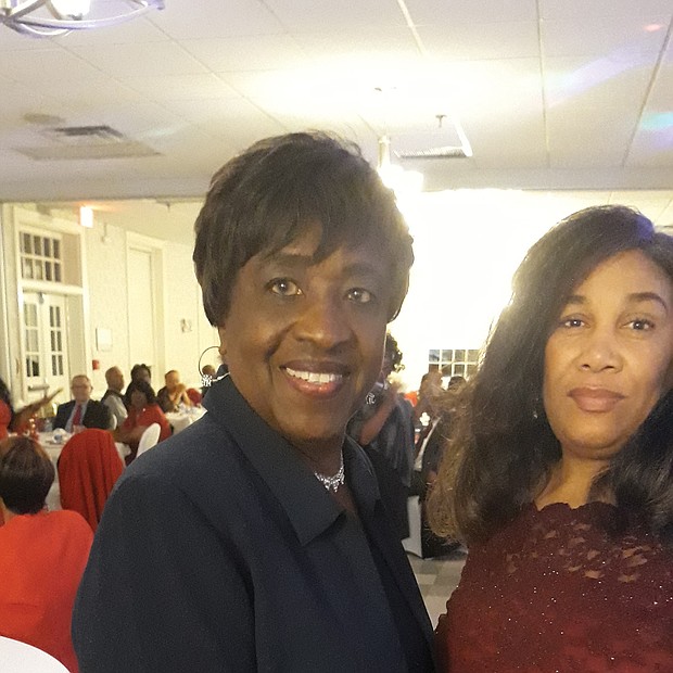 More than 100 people turned out for the 3rd Annual Holly Ball Gala sponsored by the Richmond Metropolitan Chapter of The Charmettes to raise money for cancer research. Chapter President Edna Rodwell, left, shares a moment with Melissa Dilworth, chair of the committee that staged the benefit dinner- dance on Dec. 27 at the Belmont Recreation Center in Henrico County.