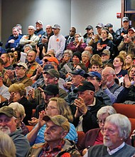Spectators break into applause as the Buckingham County Board of Supervisors vote unanimously on Dec. 9 to approve a resolution making the county a Second Amendment Sanctuary as a safe space for gun owners who reject gun control measures.