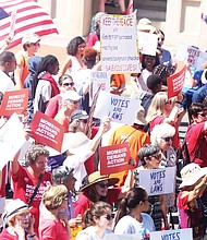 Supporters of tougher gun laws in Virginia wave signs and banners during a rally in July at the Bank Street entrance to the State Capitol before a special General Assembly session called by Gov. Ralph S. Northam to deal with gun violence in the wake of the shooting death of 9-year-old Markiya Dickson in Richmond and the mass shooting in Virginia Beach that left 12 dead. The Republican-led General Assembly adjourned, however, without considering the governor’s package of bills.