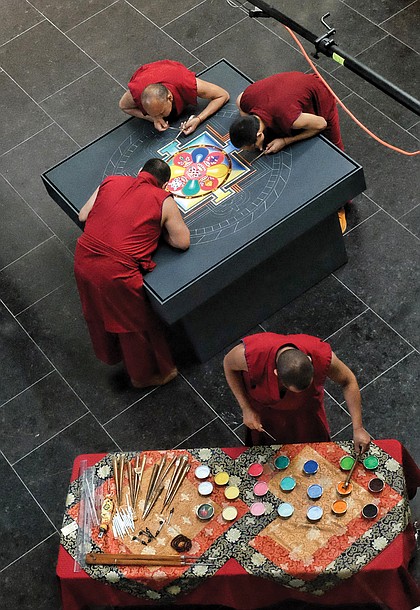 Tibetan Buddhist monks from the Drepung Loseling Monastery in India create a sand mandala in May at the Virginia Museum of Fine Arts to share Tibet’s sacred visual and performing arts in conjunction with an exhibit at the museum.