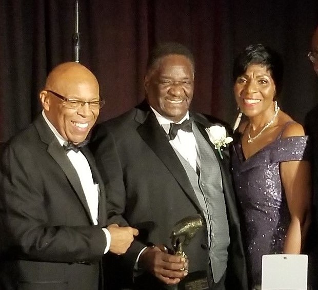 Calahan Foundation hosted its “11 Annual Celebration of Giving”, at the Hyatt Regency Chicago. Among the evening honoree were Retired Senator Emil Jones . Joining the Calahan's for a photo is the owner of Kates Security. Photo by: Tarji Smedley