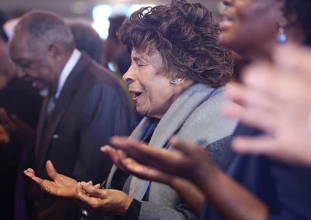 Nellie Crump Thomas prays at the New Year’s Day program at Fifth Baptist Church in the West End. The audience included leaders of Richmond City Council and the School Board, incoming Richmond state Sen. Ghazala Hashmi and other area elected officials. The Baptist Min- isters’ Conference of Richmond and Vicinity, led by the Dr. Emanuel C. Harris, hosts the event to remember the day when President Abraham Lincoln issued his Civil War proclamation on Jan. 1, 1863, freeing slaves in the South. The Rev. Ricardo Brown, co-pastor of Fifth Baptist Church, served as chair of the program that also raises money for area NAACP branches.