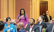 Delegate Charniele Herring of Alexandria, the new House majority leader, addresses the House chamber on Wednesday. Other delegates, from left, are Hala Ayala of Prince William County and C.E. “Cliff” Hayes Jr. of Chesapeake.