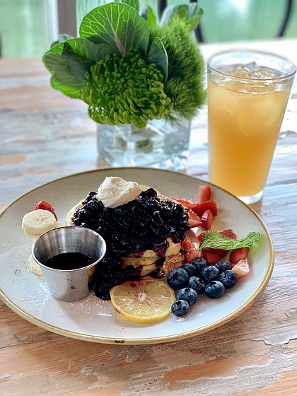 ricotta pancakes topped with blueberries and strawberries at The Dunlavy