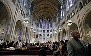 Members of the congregation file out after Sunday morning worship services at Riverside Church in New York on July 20, 2014. The building is modeled after a 13th century cathedral in Chartres, France.