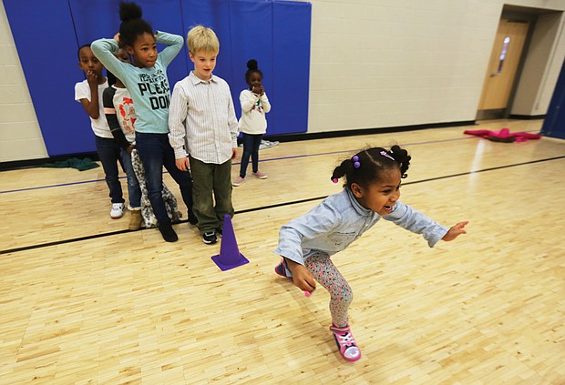 Alani Mason, 6, takes off in a sprint to the finish line during a game Tuesday at the Northside Family YMCA on Old Brook Road. The youngster and her friends in the YMCA after-school program were ready to burn some energy after returning to school this week at the start of a new decade.