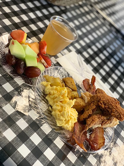 fried chicken, eggs, potatoes, bacon, and fruit from The Breakfast Klub