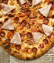 meat lovers pizza at the C. Baldwin Lobby Bar