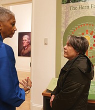 Black History Museum Executive Director Adele Johnson left, talks with Karen Schwarzkopf of Richmond Family magazine about the exhibit on the enslaved at Monticello that will run Jan. 18 through April 18 at the museum.