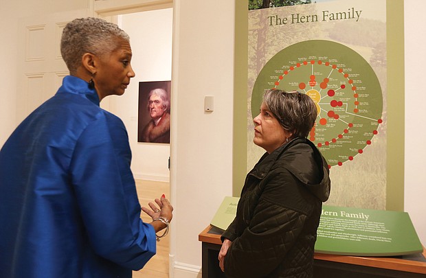 Black History Museum Executive Director Adele Johnson left, talks with Karen Schwarzkopf of Richmond Family magazine about the exhibit on the enslaved at Monticello that will run Jan. 18 through April 18 at the museum.