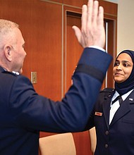 U.S. Air Force Chaplain Candidate Saleha Jabeen, right, is commissioned last month by Maj. Gen. Steven Schaick U.S. Air Force chief of chaplains at the Catholic Theological Union in Chicago.