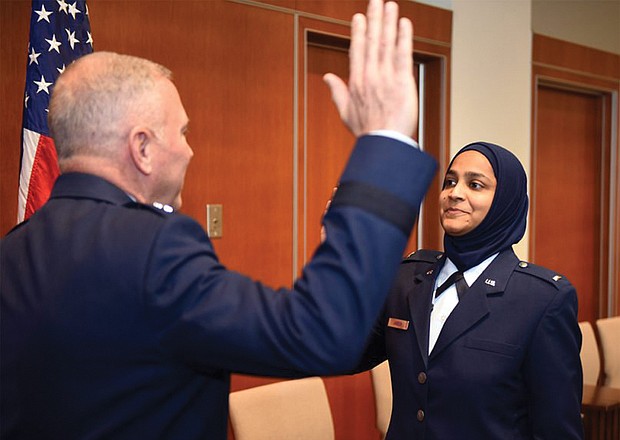U.S. Air Force Chaplain Candidate Saleha Jabeen, right, is commissioned last month by Maj. Gen. Steven Schaick U.S. Air Force chief of chaplains at the Catholic Theological Union in Chicago.